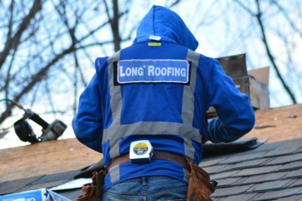 Long Roofing roofer on a roof