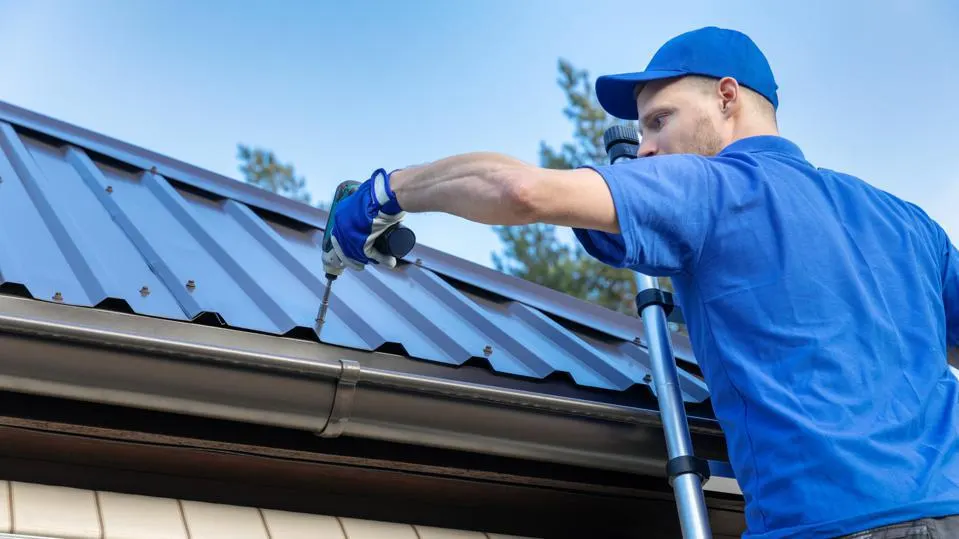 image of man working on a roof